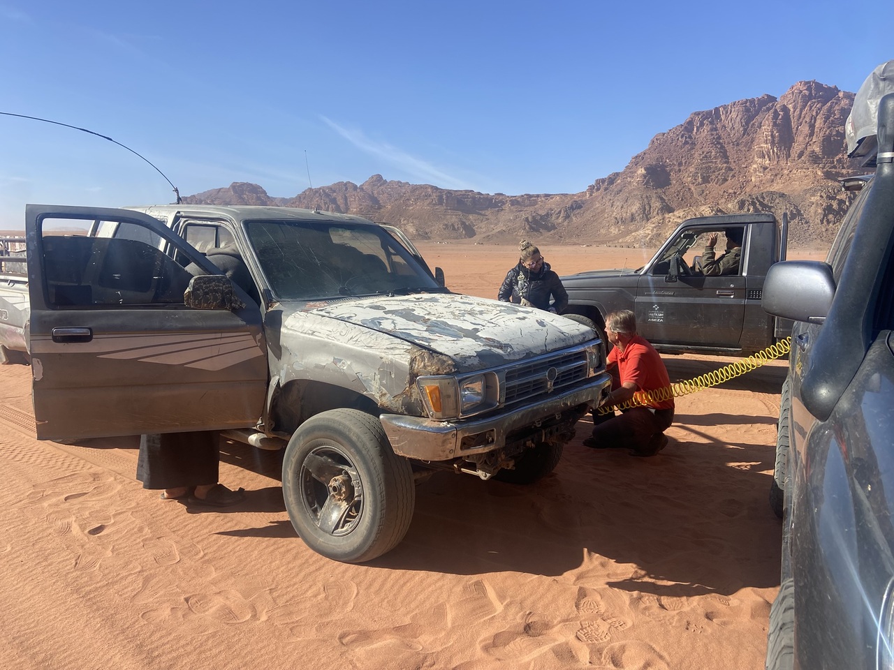 The Beast pumps the tire of a Bedouin guide
